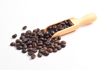 Roasted coffee beans in wooden spoon isolated on white background