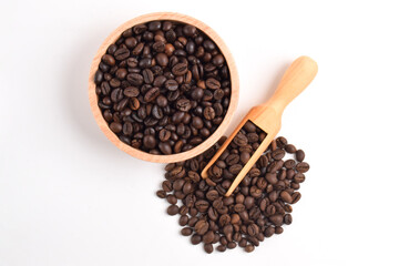 Coffee beans in wooden bowl isolated on white background