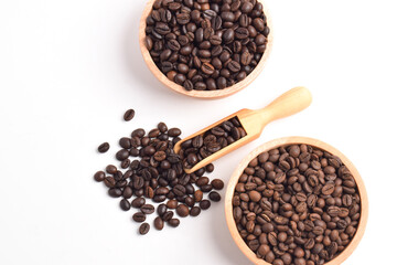 Roasted Coffee beans in wooden bowl isolated on white background