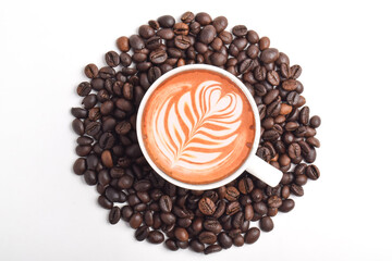 Coffee with Latte Art and Coffee Beans Isolated on White Background. Top View