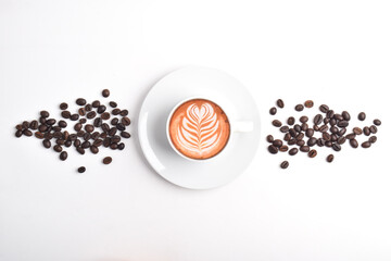 Coffee Day Celebration. Cup of latte coffee and coffee beans isolated on white background