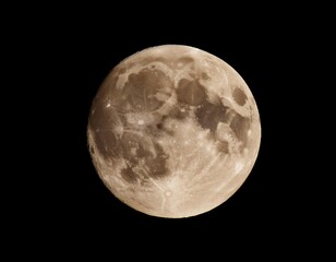 Naklejka premium Full moon illuminating the night sky, representing lunar phases, astronomy, and nighttime beauty.