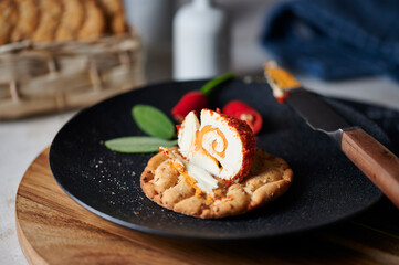 Rolled cream cheese with chili and pepper on crispbread
