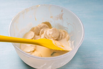 Tempering of white professional chocolate. The process of making handmade chocolates.
