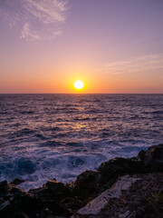Fototapeta premium Sunset in the bay of Amoudi on Santorini.