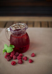 cold raspberry lemonade on the table in the summe