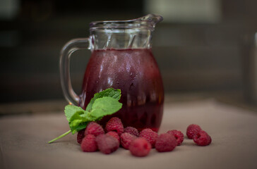 cold raspberry lemonade on the table in the summe