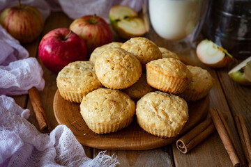 Delicious dessert: Apple muffins for breakfast on a wooden table. Close-up. Cupcakes with apples