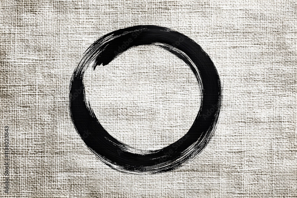 Poster a simple black circle on a textured beige background, symbolizing simplicity and completeness.