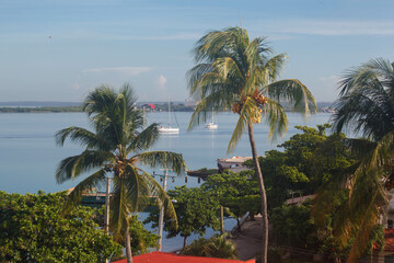 A red dock in the horizon and sailboats at bahia de Cienfuegos, Cuba