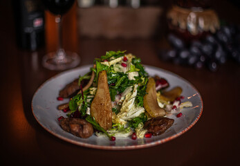 pear and beef liver salad on the restaurant table