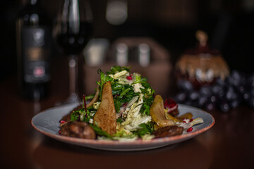 pear and beef liver salad on the restaurant table