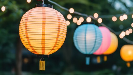 Fototapeta premium Illuminated Paper Lanterns Hanging Outdoors at Night Party