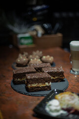 desserts on the restaurant table against the background of a coffee drink