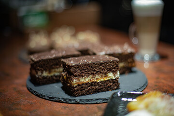 desserts on the restaurant table against the background of a coffee drink