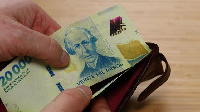 Argentina money. New banknotes of 20,000 Argentine pesos in wallet. Financial business concept. Close up