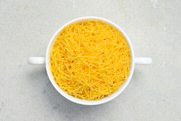 Raw Italian Vermicelli in a bowl. Cooking background. Italian food concept.