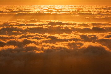 Ethereal sunrise with golden clouds