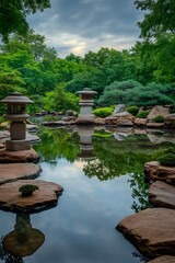 A serene garden landscape with a tranquil pond reflecting greenery and stone lanterns.