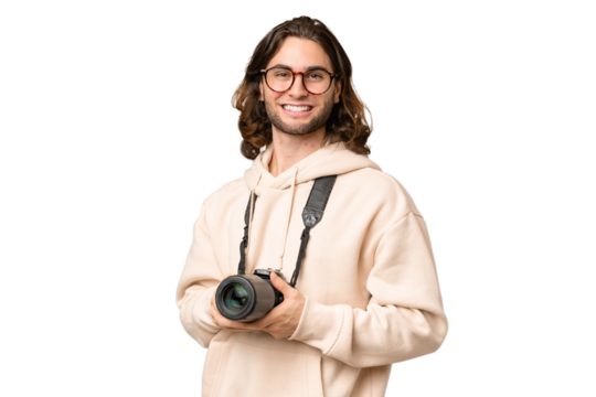 Young photographer man over isolated background with arms crossed and looking forward