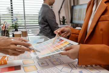 ux developer and ui designer brainstorming about mobile app interface wireframe design in the...