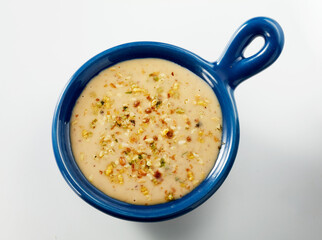 Salad sauce in small bowl isolated on white background