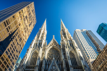 St. Patrick's Cathedral on 5th Avenue in Manhattan, New York City, USA, surrounded by Skyscrapers