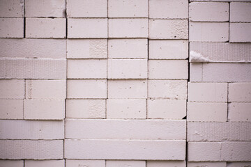 Stack of white lightweight bricks, materials for building houses
