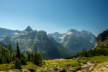 Thunderbird Mountain and Mount Carter Rise To The Clear Blue Sky Over Glacier