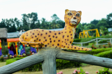 The tiger seat and watch in front in natural park holyday