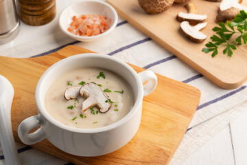 Creamy mushroom soup with Shiitake in ceramic bowl.