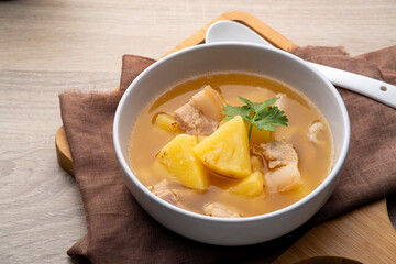 Pineapple Sour Soup with Pork Belly in white bowl