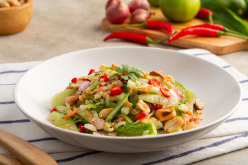 Spicy Cucumber Salad.Ancient thai food,cucumber in chilli garlic lime sauce topping with dried shrimp and roasted peanuts.