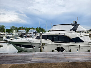 A stylish luxurious yacht elegantly docked at a marina