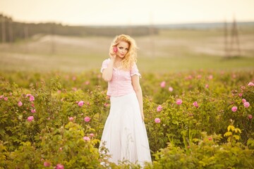 Spring Woman in Rose Field.