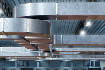 Steel ventilation pipes. Shafts for supplying purified air. Ventilation system pipes under ceiling....