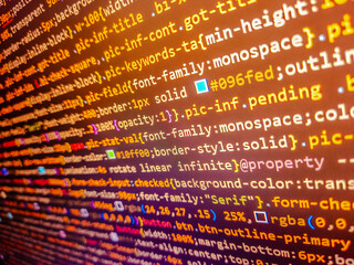 Developer working on program codes in office. Structured sql code on monitor. Application source code background. Html php java source code. Javascipt with web programming. Source code.