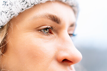 close-up of a womans face in winter showing her joyful expression