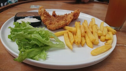 Crispy French Fries with Fried Chicken and Dipping Sauces
