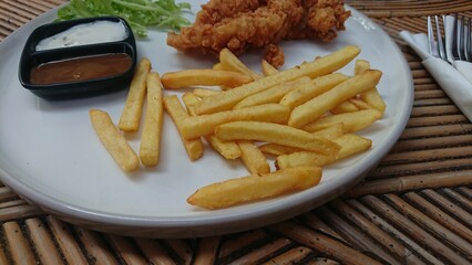 Crispy French Fries with Fried Chicken and Dipping Sauces