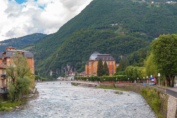 SAN PELLEGRINO TERME, ITALY - MAY 12, 2024: Old spa hotel by the river