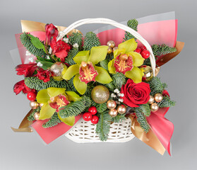 A traditional Christmas floral arrangement of green fir branches and flowers. New Year's decor for...