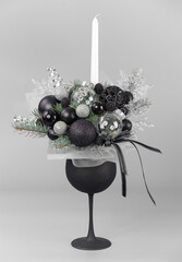 A traditional Christmas floral arrangement of green fir branches and flowers. New Year's decor for the interior
