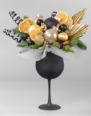 A traditional Christmas floral arrangement of green fir branches and flowers. New Year's decor for the interior