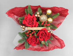 A traditional Christmas floral arrangement of green fir branches and flowers. New Year's decor for the interior