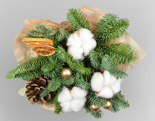 A traditional Christmas floral arrangement of green fir branches and flowers. New Year's decor for the interior