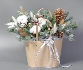 A traditional Christmas floral arrangement of green fir branches and flowers. New Year's decor for the interior