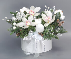 A traditional Christmas floral arrangement of green fir branches and flowers. New Year's decor for the interior