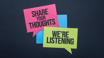 Two overlapping speech bubbles on a dark textured background. One pink bubble says "SHARE YOUR THOUGHTS" and the other yellow-green bubble says "WE'RE LISTENING," conveying feedback, dialogue, and com