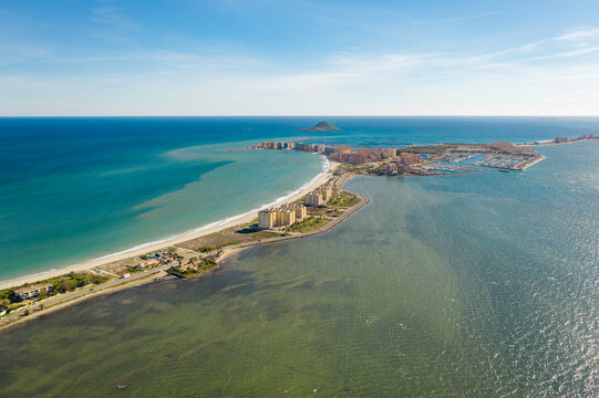 Aerial view of The Sandbar of the Minor Sea, is a seaside spit of Mar Menor in the Region of Murcia, Spain. The strip is 21 km long separating the Mediterranean Sea from the Mar Menor lagoon. Travel